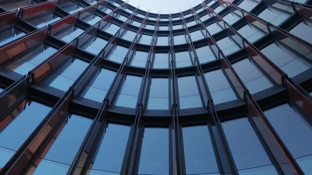 Reflection of a modern, colourful curved office building, Cologne, Germany