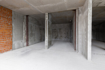 Empty concrete commercial space without finishing with partitions