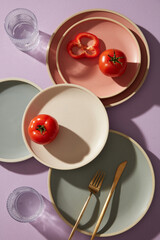 Colorful set dish on the purple table. Modern interior for decoration kitchen or restaurant. Design cooking book or magazine