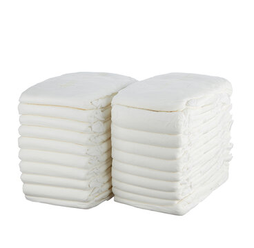 Diapers are white, now, stacked in two neat big piles, isolated on a white background.