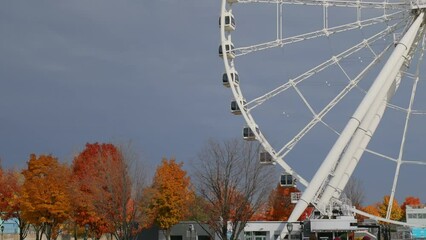 A View Of The Largest Observation Wheel Of La Grande Roue de Montréal During Autumn In Quebec, Canada. Wide Shot