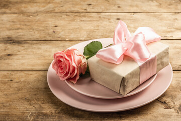 Romantic dinner table on rustic background. Love cutlery for Valentine's or Mother's day, Wedding