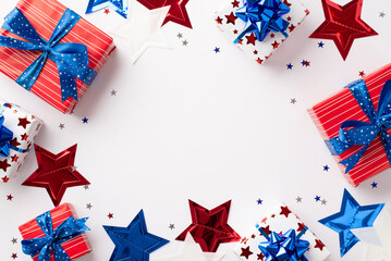 Obraz premium Forth of July celebration concept. Top view photo of gift boxes in national flag colors star garland and confetti on isolated white background with copyspace in the middle