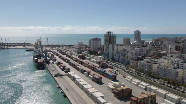 Aerial: Containers loaded onto freight ship in Albanian Durres Port