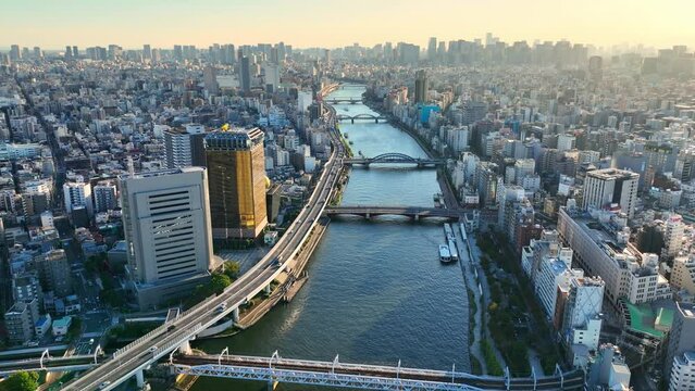 flying above downtown Tokyo at sunset, aerial view of Sumida River in Tokyo, Japanese capital, modern urban metropolis, famous travel destination in Asia
