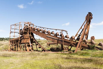 Fotobehang Abandoned gold mining machine in Tierra del Fuego in Chile © Fyle