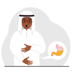 The concept of pain in the abdomen. The arab man holds his stomach with both hands. Problems with the stomach or digestion.