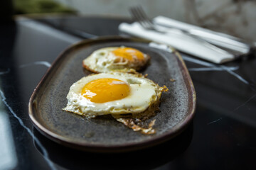 fried eggs in a frying pan