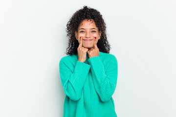 Young african american woman isolated doubting between two options.