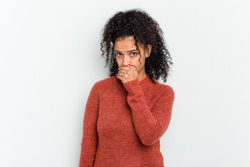Young african american woman isolated covering mouth with hands looking worried.