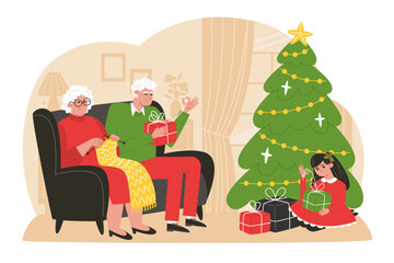 Obraz na płótnie Canvas Grandpa and grandma unpack Christmas presents with their granddaughter