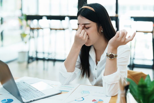 Portrait Of Sme Business Owner, Woman Using Computer And Financial Statements Anxious Expression On Expanding The Market To Increase The Ability To Invest In Business