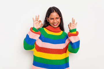Young Indian woman isolated on white background cheerful and confident showing ok gesture.