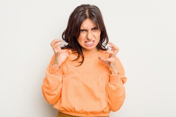 Young Indian woman isolated on white background upset screaming with tense hands.