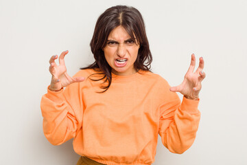 Young Indian woman isolated on white background screaming with rage.