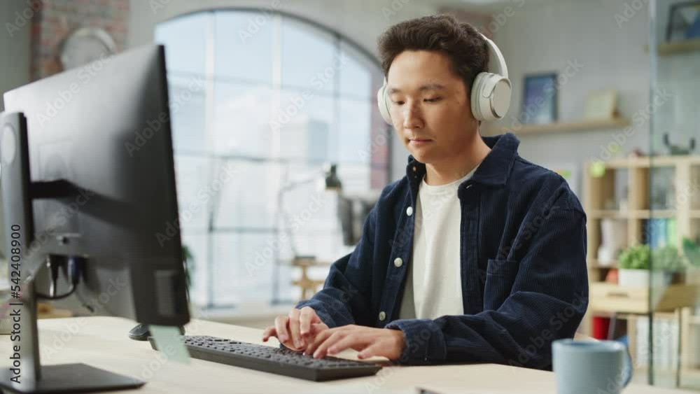 Aufkleber portrait of asian male employee working on computer in a modern office during the day. customer supp