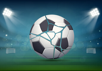 Obraz premium Bursting and torn soccer ball lies on the grass