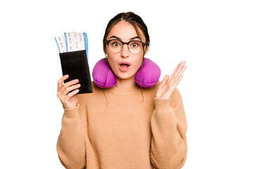 Young caucasian woman with inflatable travel pillow holding passport isolated on green chroma...