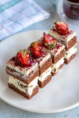 Strawberry mini cakes or tartlet on gray background. Bakery products. close up