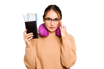 Young caucasian woman with inflatable travel pillow holding passport isolated on green chroma background pointing temple with finger, thinking, focused on a task.