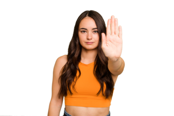 Young caucasian woman isolated on green chroma background standing with outstretched hand showing stop sign, preventing you.
