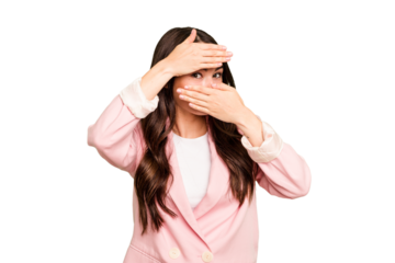 Young caucasian woman isolated on green chroma background blink at the camera through fingers, embarrassed covering face.
