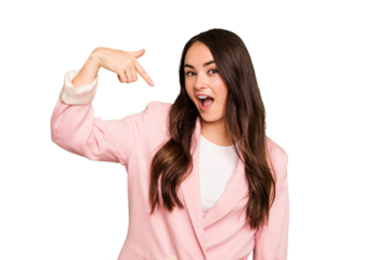 Young caucasian woman isolated on green chroma background person pointing by hand to a shirt copy space, proud and confident
