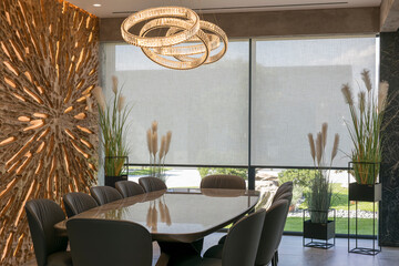 Roller blinds in the interior. Automatic solar shades large size on the window. Modern interior...