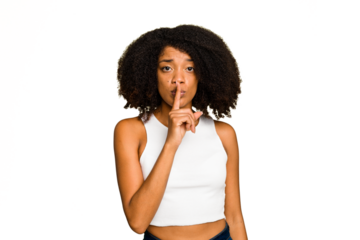 Young African American woman isolated keeping a secret or asking for silence.