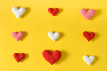 Different hearts on a yellow background. Tic-tac-toe game.