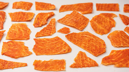 Group of tasty beer snacks. Dehydrated chicken meat slices.