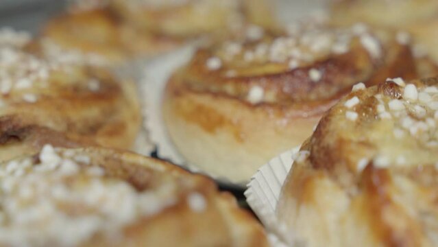 Close up slider shot of a pile of cinnamon buns at a Swedish fika
