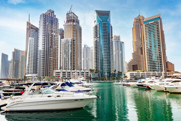 Obraz na płótnie Canvas Dubai marina with yachts in UAE