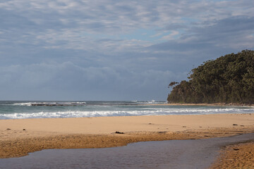 Cloudy sky on Mollymook beach, near Uladulla, Australia