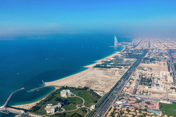 Burj Al Arab hotel in Dubai UAE aerial view at sunset