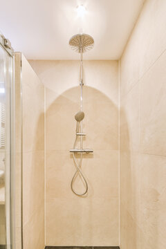 View Of Shower Head On Wall In Bathroom
