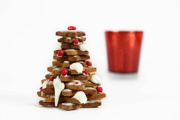 Close-up shot of a gingerbread Christmas tree made out of star-shaped cookies