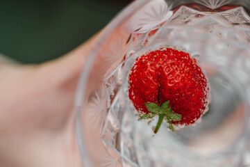 Strawberries in a glass with a cocktail, top view