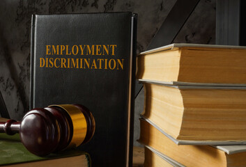 Book with law about Employment discrimination and gavel.