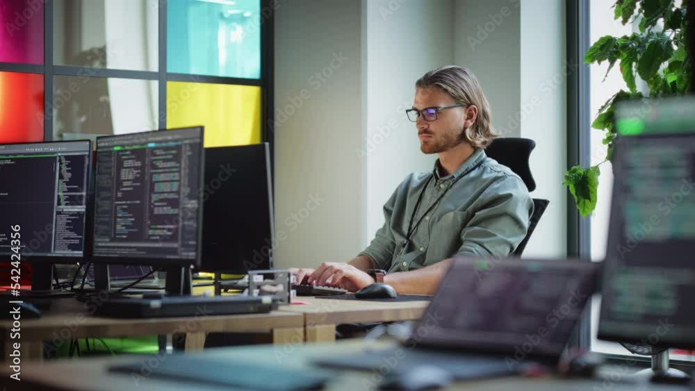 Leinwandbilder Male Data Scientist Coding on Desktop Computer in Creative Office Space. Caucasian Man Scraping Digital Information From Opened Sources in Internet For Artificial Inteligence Software Development.