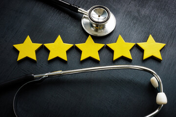 Five stars and stethoscope as concept of patient satisfaction.