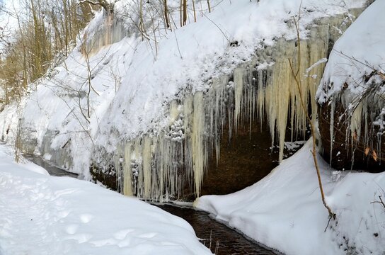 wintery scene with icicles at gorge Drachenschlucht Eisenach