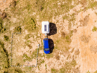 Caravan trailer camping on coast. Aerial view