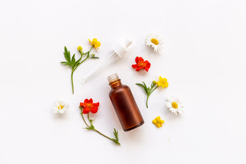 Cosmetic bottle with pipette and medicinal herbs essential oil