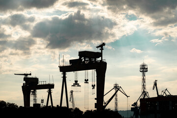 Seaport cranes. Silhouette of cranes.