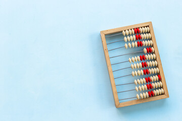 Vintage accounting wooden abacus. Financial calculations concept