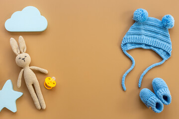 Baby infant hat with booties and kids accessories, flat lay