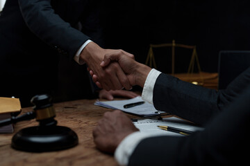 Fototapeta na wymiar Businessman and Lawyer handshaking after good deal. Law, legal services, advice, Justice concept