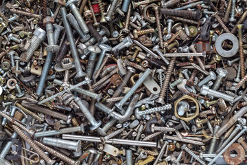 A large collection of screw nut backgrounds that are collected to be reused when needed are screws that have been removed from worn out appliances that cannot be repaired. Copy Space for Text