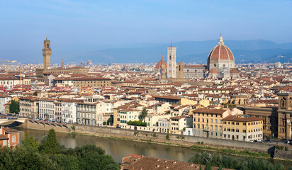 Fototapeta na wymiar city scape of world heritage city of Florence in Tuscany, Italy with Dome and river Arno